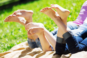 family having picnic in summer park | Dr. Tilara