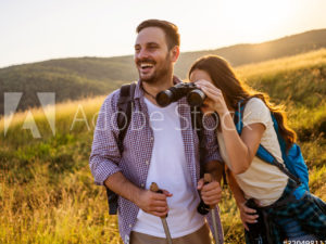 man hiking and laughing